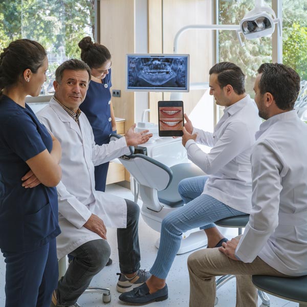 dental professionals talking about x-ray