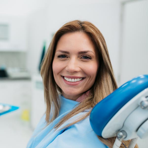 person smiling at the dentist
