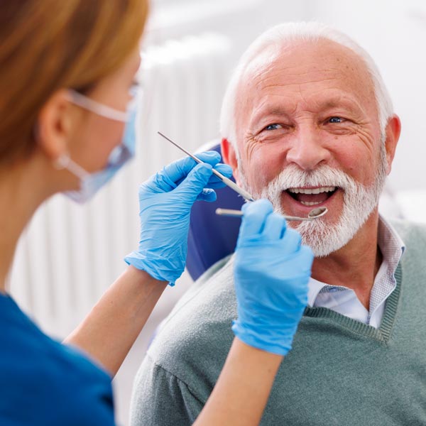 older person at the dentist